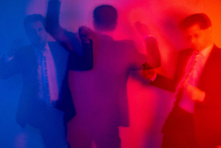 Shadow of man with arms raised