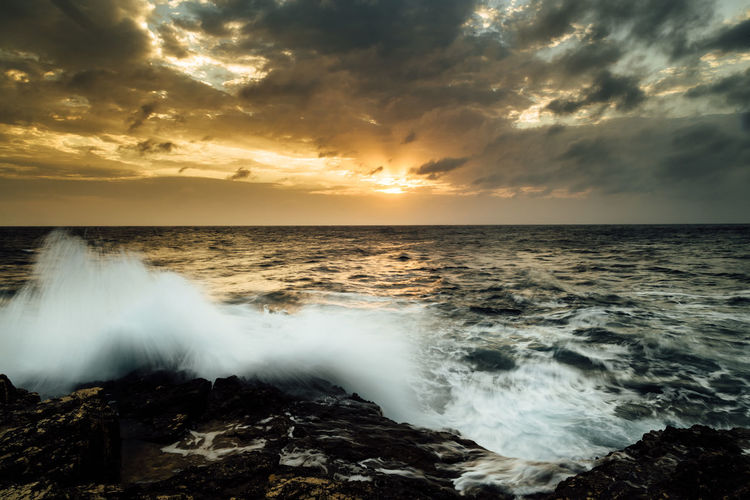 Scenic view of sea against sky during sunset