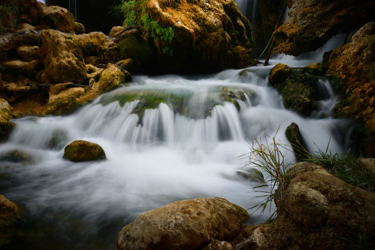Long exposure of river cascading rocks, stones at kravica waterfalls, bosnia herzegovina, europe