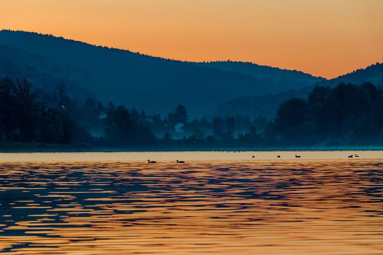 Scenic view of landscape against sky during sunset