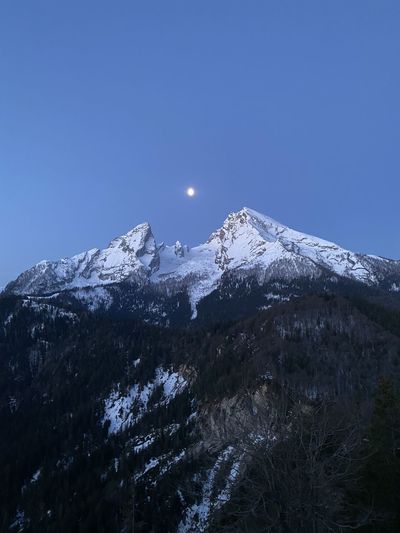 Moon and the mountain watzmann dancing together in the morning hours 