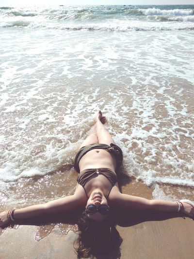 Woman on beach wave feel