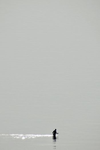 Man walking in the sea