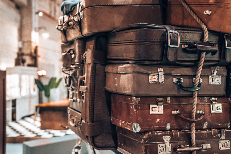 Vintage pile ancient suitcases form of tower design concept travel luggage