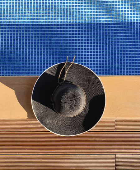 Panama hat on swimming pool, summer concept