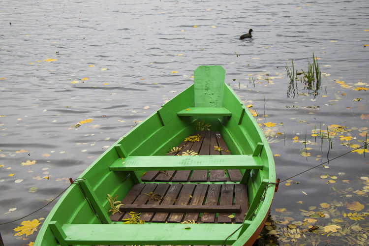 Old wooden boats near the beach of trakai gavle lake , lithuania. autumn and fall time.