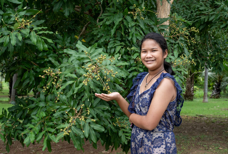 Woman and longan in thailand