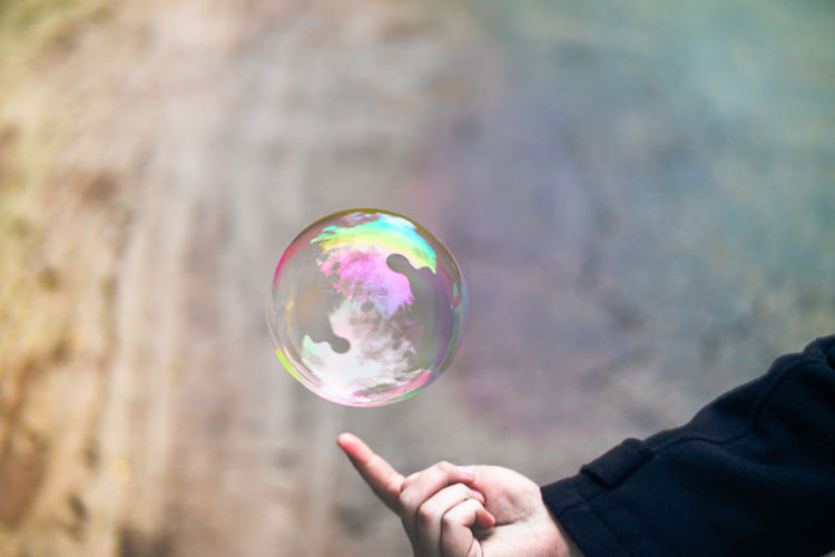 Close-up of hand holding bubbles