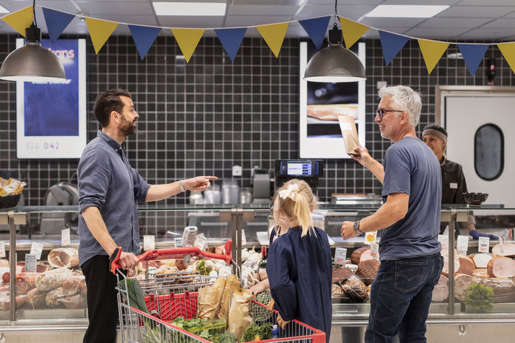 Customers talking in supermarket
