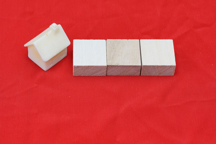 High angle view of bread on table against red background