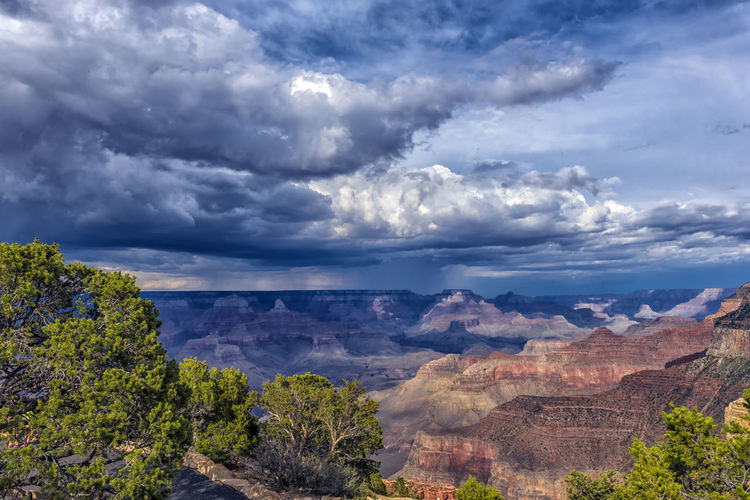 Scenic view of landscape against cloudy sky