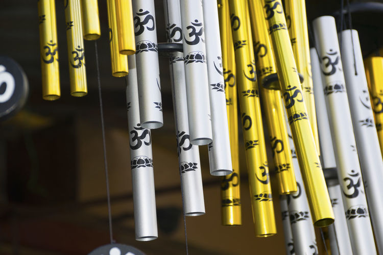 Low angle view of wind chimes at market stall