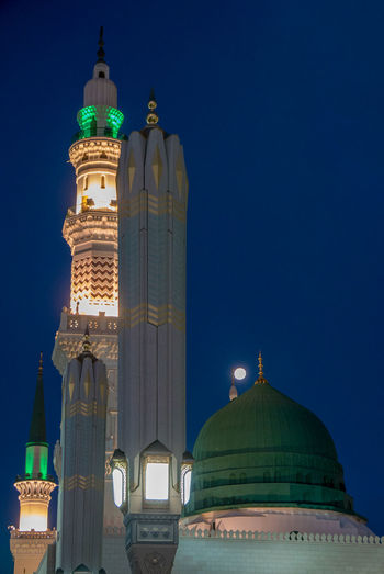 Low angle view of illuminated building against sky at night nabawi mosque