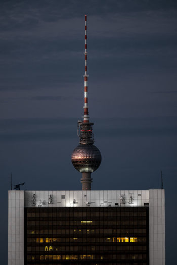 Fernsehturm against sky at night