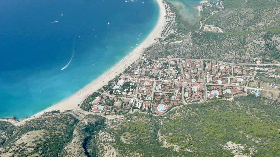 High angle view of beach and buildings in holiday resort