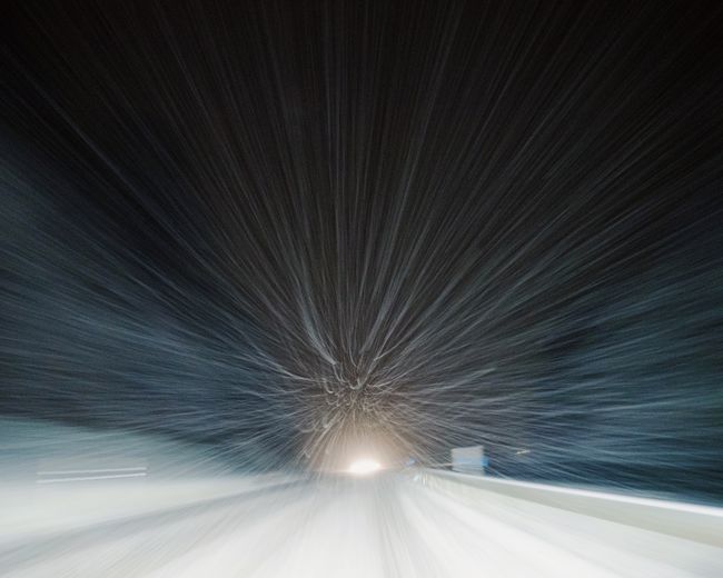 Blurred motion of road against star trail