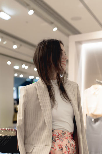 Woman trying on clothes in store