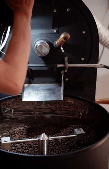 Cropped image of man preparing coffee