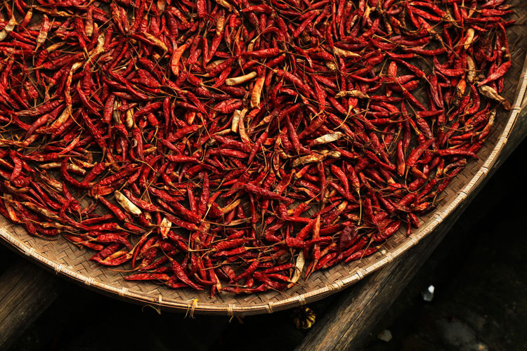 High angle view of dry red chili peppers in wicker