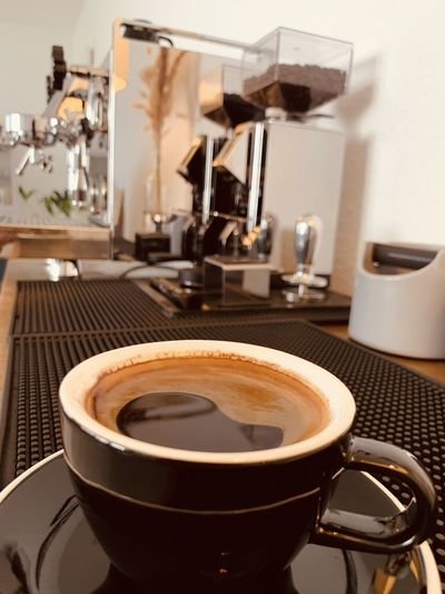 Close-up of coffee cup on table