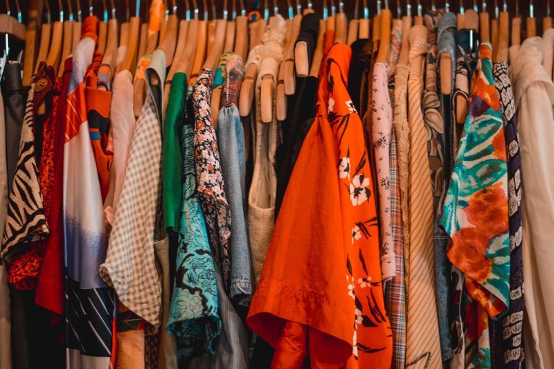 Full frame shot of clothing hanging on rack in store