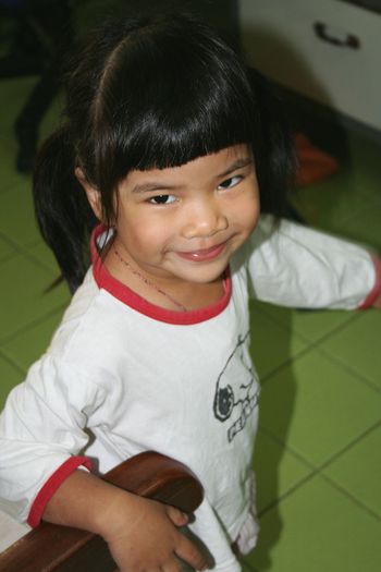Portrait of smiling girl standing at home