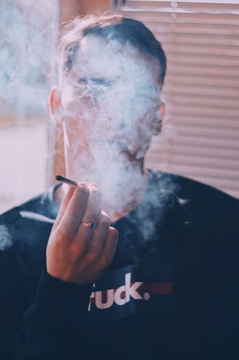 Man smoking marijuana joint