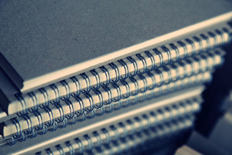 Stack of spiral notebooks