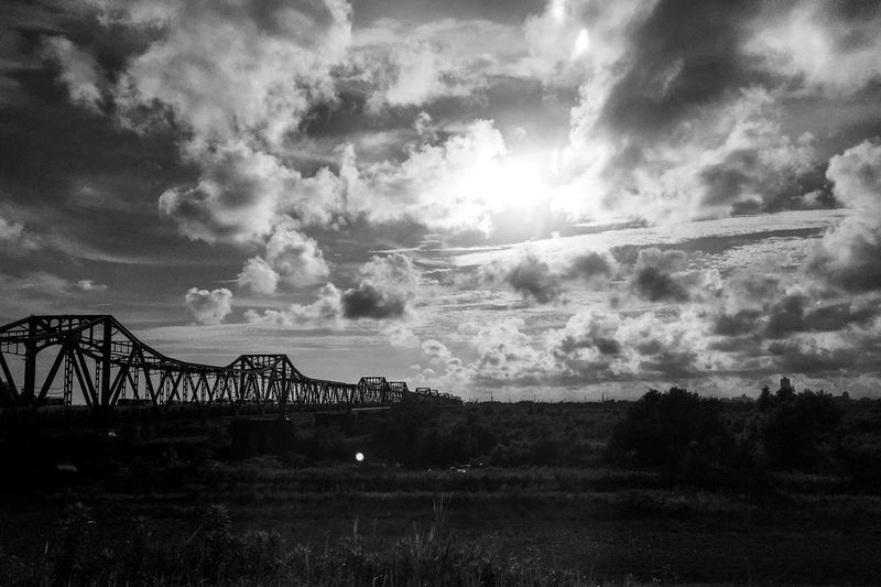 Scenic view of bridge over landscape against sky