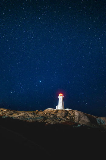 Stars over peggy's point lighthouse, nova scotia, canada