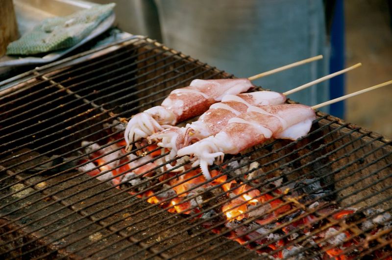 Meat cooking on barbecue grill