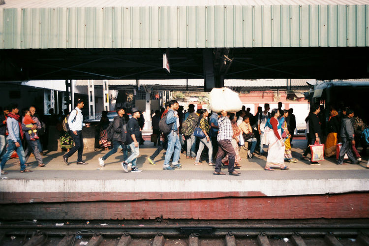 People standing on railroad station platform