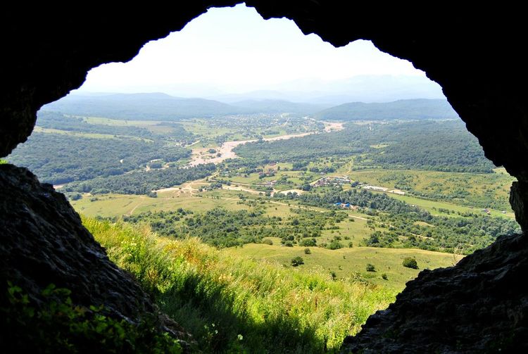 Scenic view of landscape seen from cave