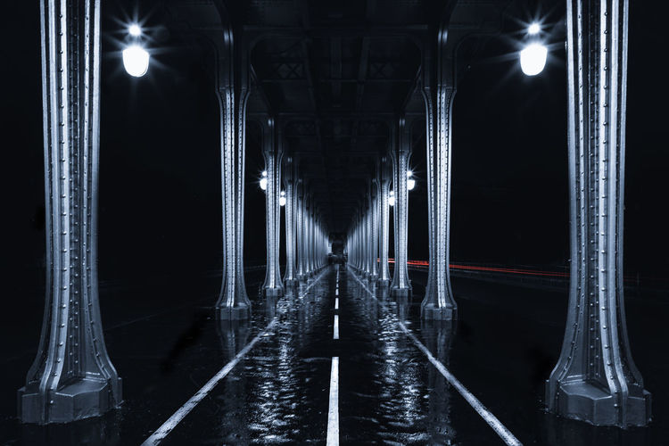 Digital composite image of illuminated bridge