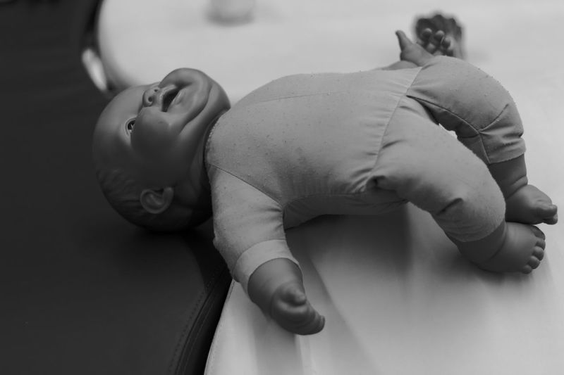 Close-up of doll on table at home