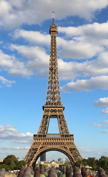 Eiffel tower in france paris in a summer day with clear sky and white clouds