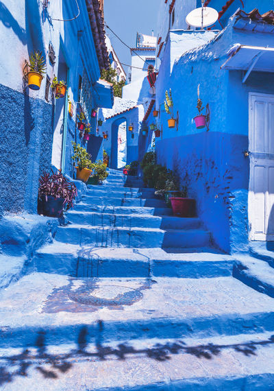 Staircase amidst buildings in city