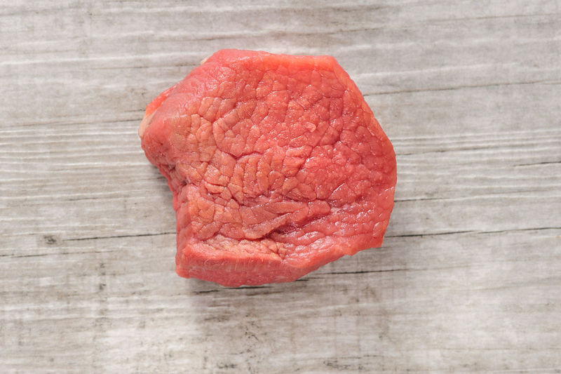 Close-up of raw steak on table