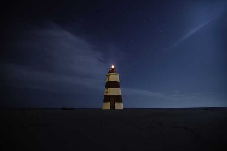 Low angle view of lighthouse at night