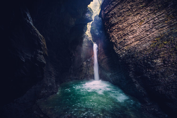 Kozjak waterfall in a cave near kobarid, soca valley, slovenia.