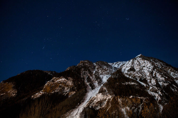 Scenic view of mountains at night