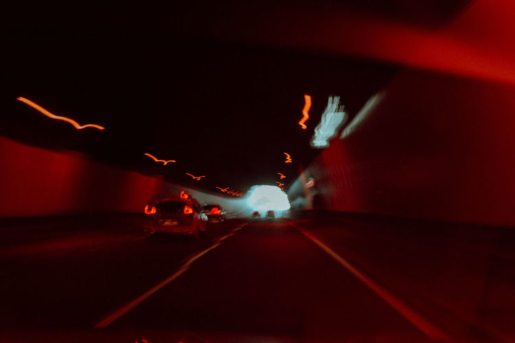 Illuminated road in tunnel
