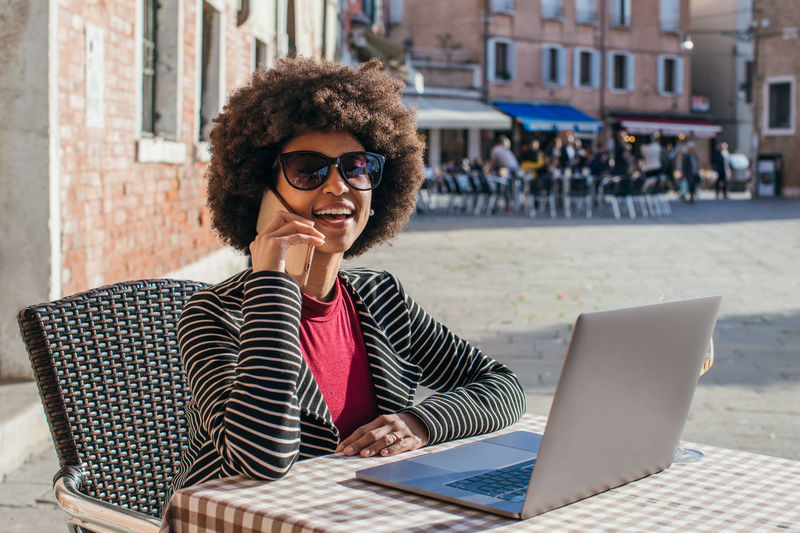Young business woman making a phone call smiling