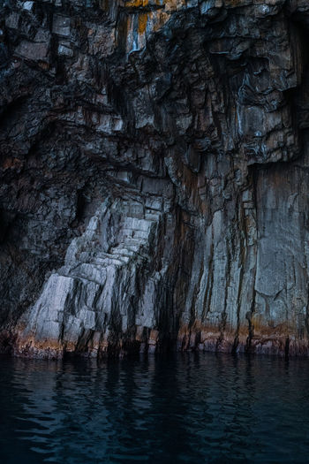 Rock formations in a cave filled with water