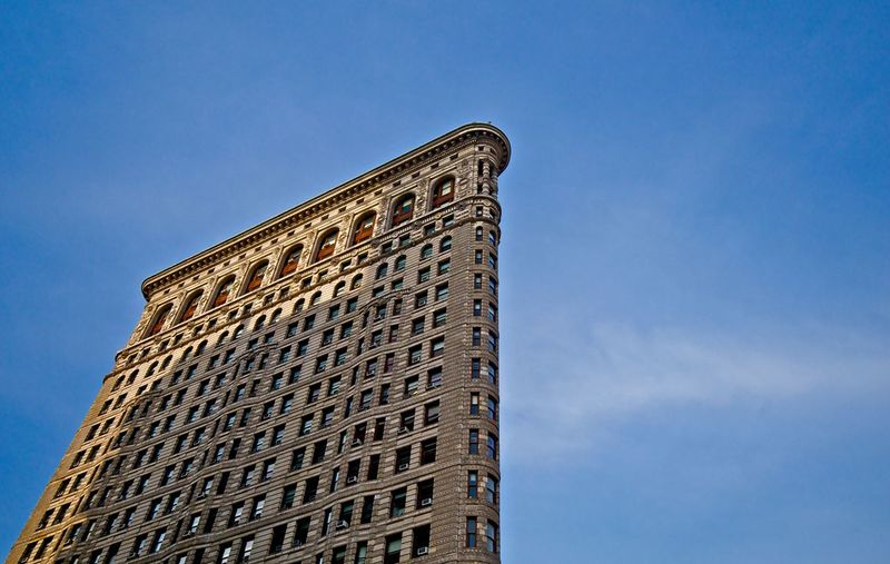 Low angle view of flatiron building against sky