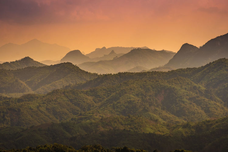 Scenic view of mountains against sky during sunset