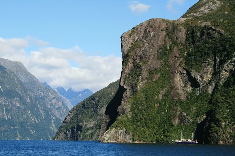 Milford sound by mountains against sky