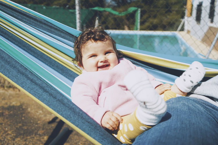 Portrait of mother cute baby with father outdoors