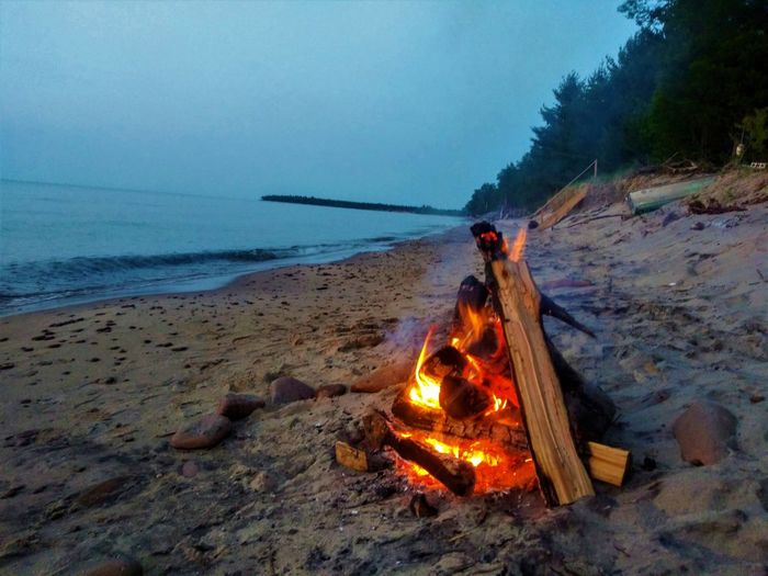 Bonfire on lake superior in upper michigan