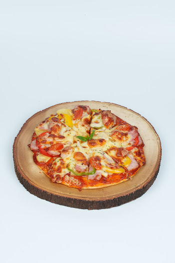 Close-up of pizza against white background